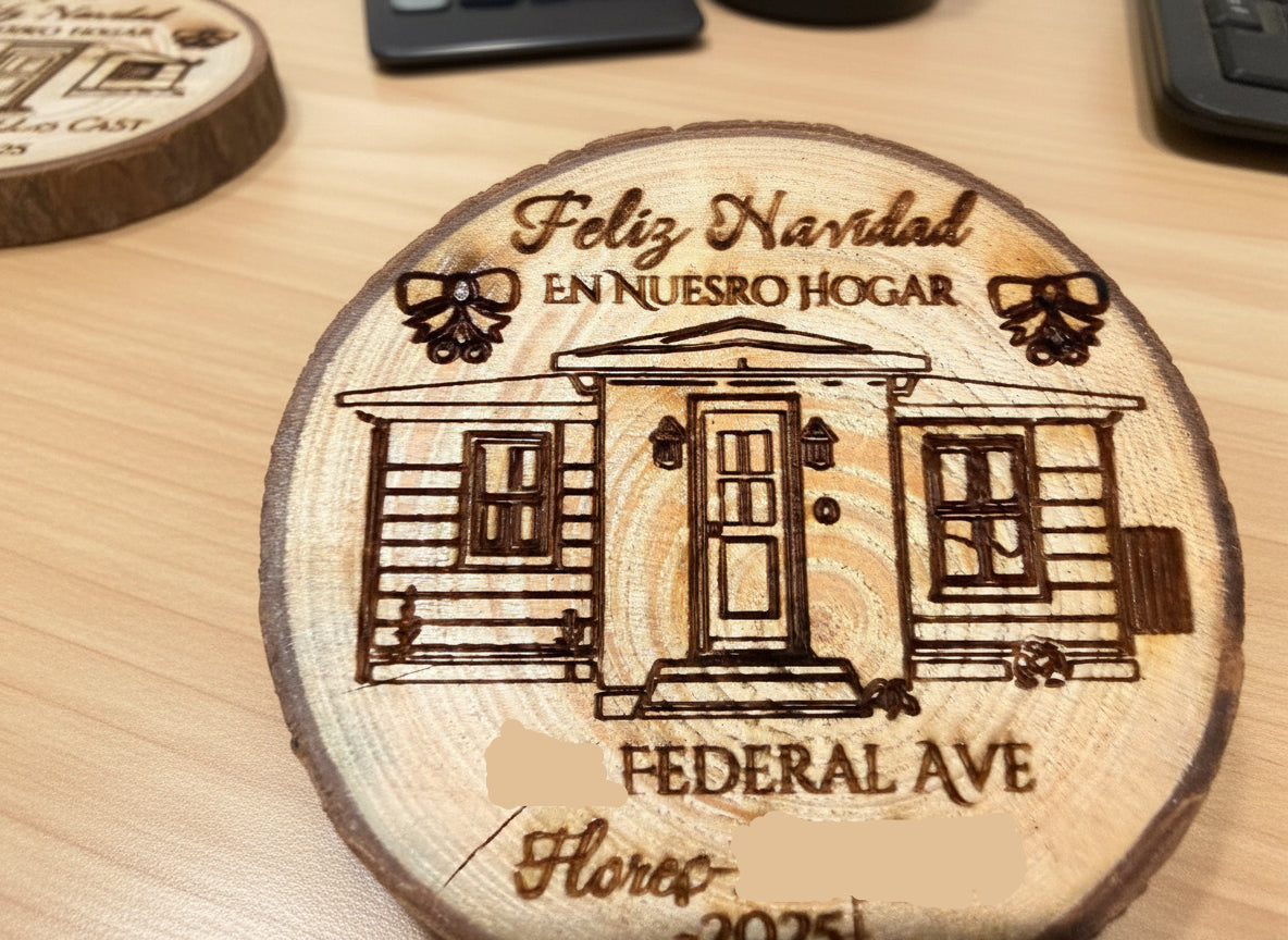Wooden ornament with engraved house illustration and text